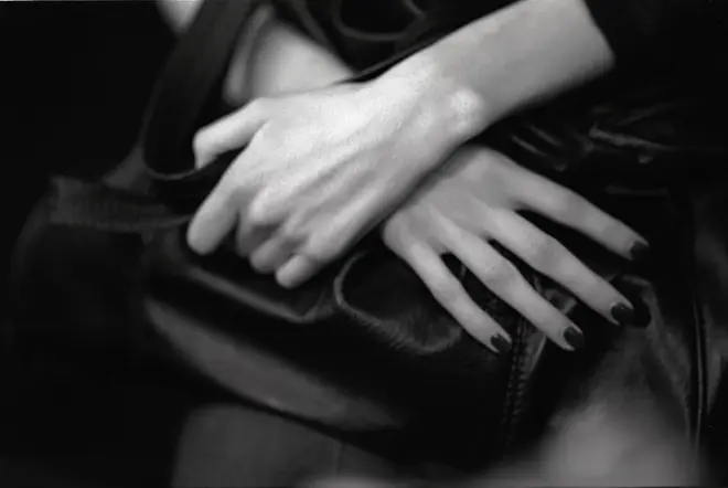 Her hands folded in her lap