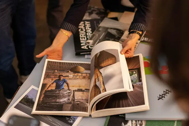 A photobook is being reviewed by Alexa Becker