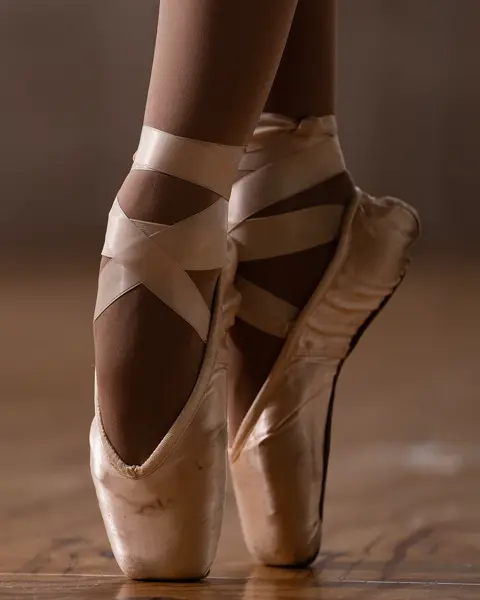 Close-up of a ballerina's feet in ballet shoes. 