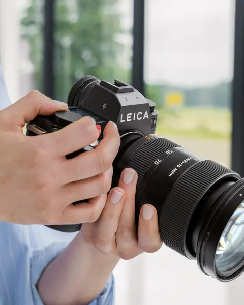 Woman holding a camera in her hands