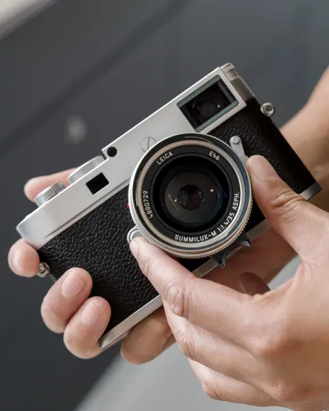 Man operating a Leica Camera