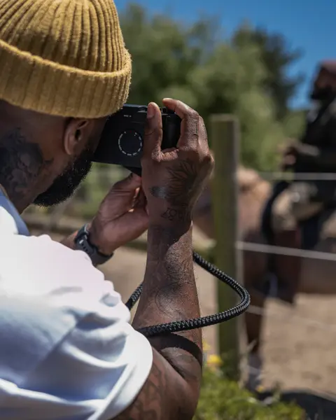 Brandon Ruffin photographs a horse with a Leica Camera