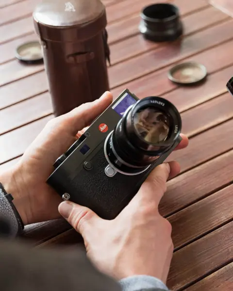 Two people are holding Leica M-Cameras