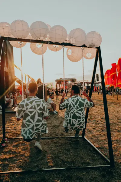 Two men on a swing at the Sunny Hill Festival