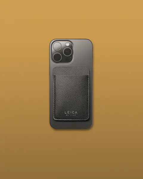 Black magnetic card holder on iphone case.