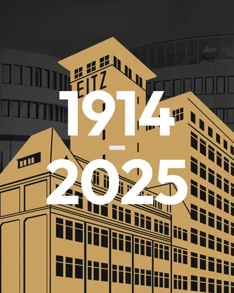 Grafik Leitz factory in front of Leica office building. Lettering 1914-2025.