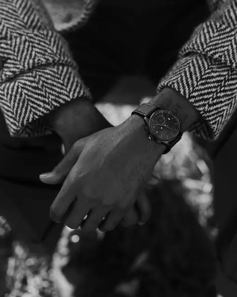 Brandon Ruffin sitting on a bank with his Leica ZM2