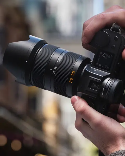 A person is taking photographs with the Leica SL.