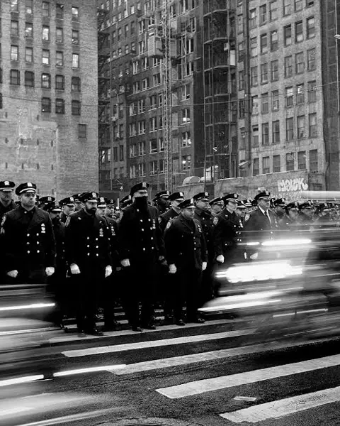 soldiers walking on street b&w