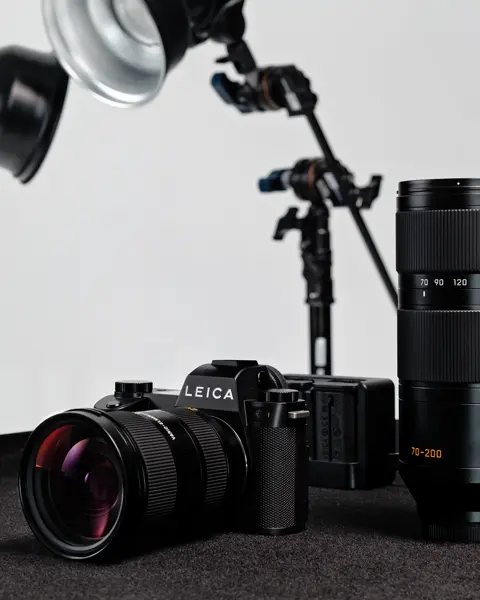 Leica SL3-P with Vario-Elmarit-SL 24-70 on a table next to the Vario-Elmarit-SL 70-200