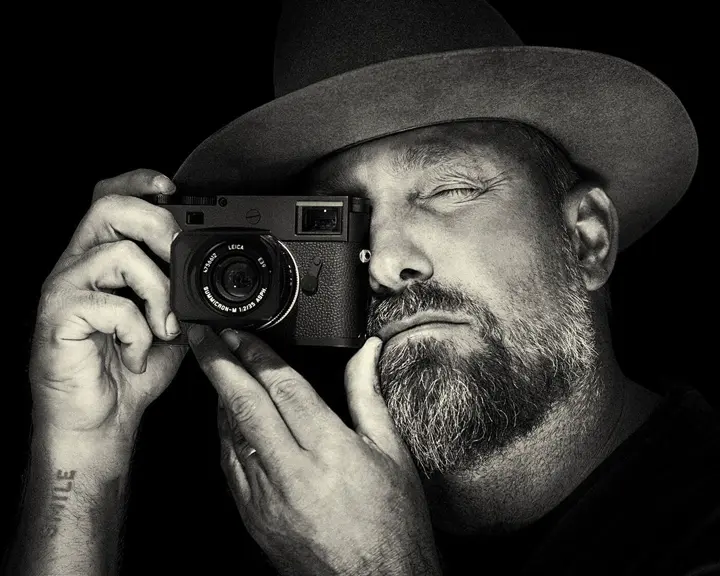 Close-up of a man taking a picture.