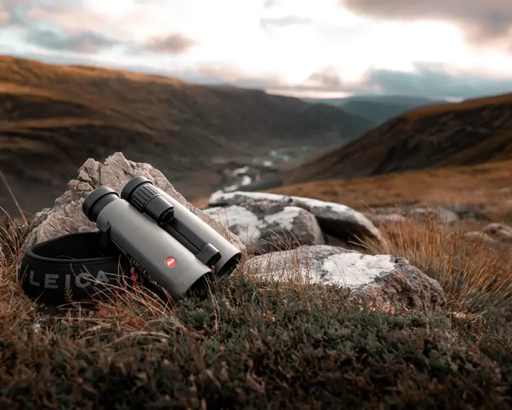 Leica-Noctivid-binoculars-lying-on-a-stone-in-the-Scottish-Highlands