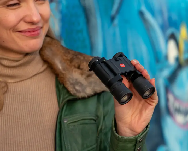 A woman holding the Trinovid BCA
