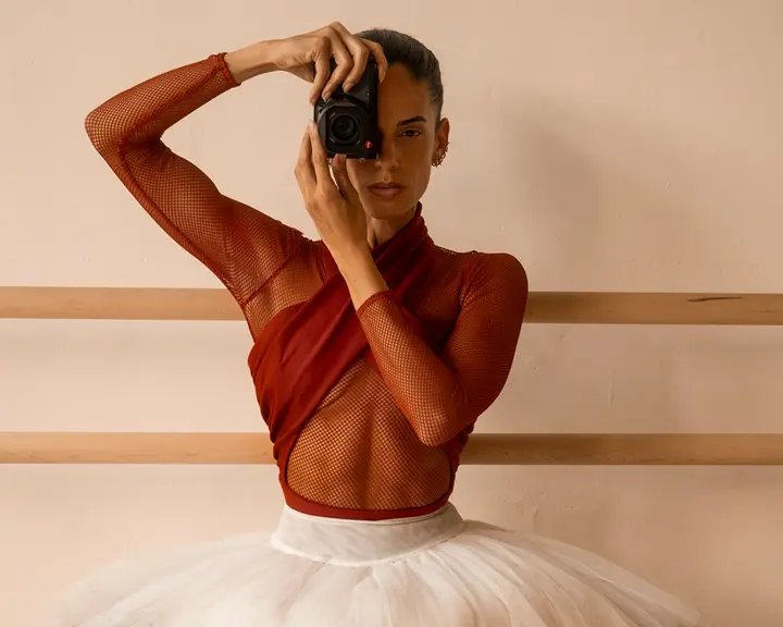 Kylie Shea with a leica camera