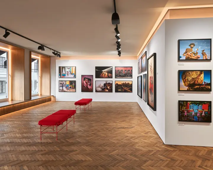Images on the wall in a Leica Gallery.