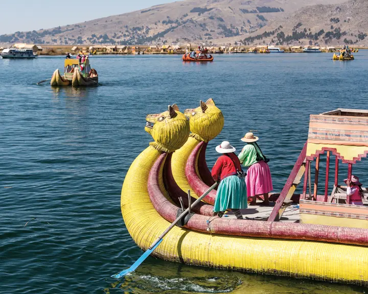 2 women on a yellow dragon boat in Latin America