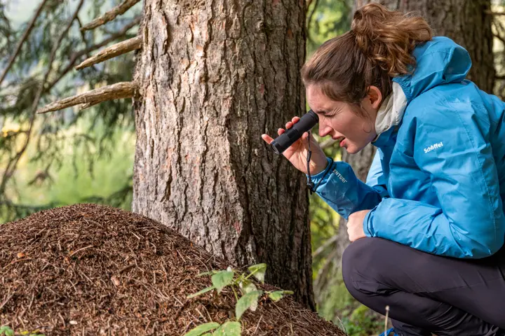Woman is looking through her Leica Monovid