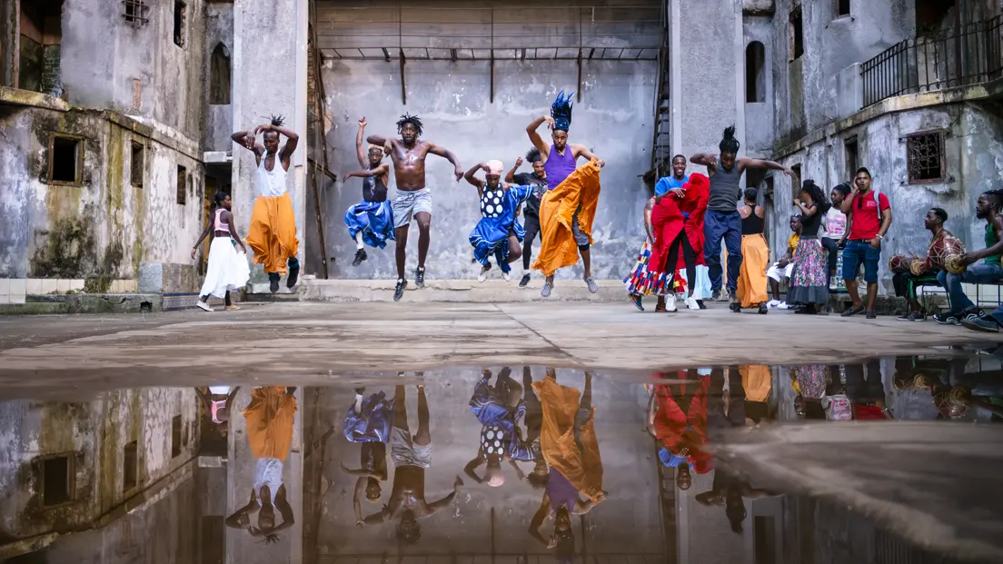 A group of people dance 
