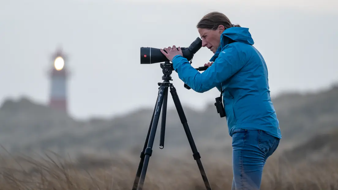 Woman is using her Leica APO-Televid