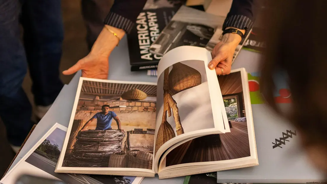 A photobook is being reviewed by Alexa Becker