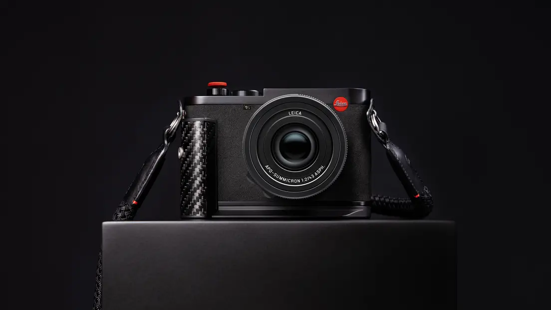 Leica Q3 43 Formula 1® Edition on a table, front view.