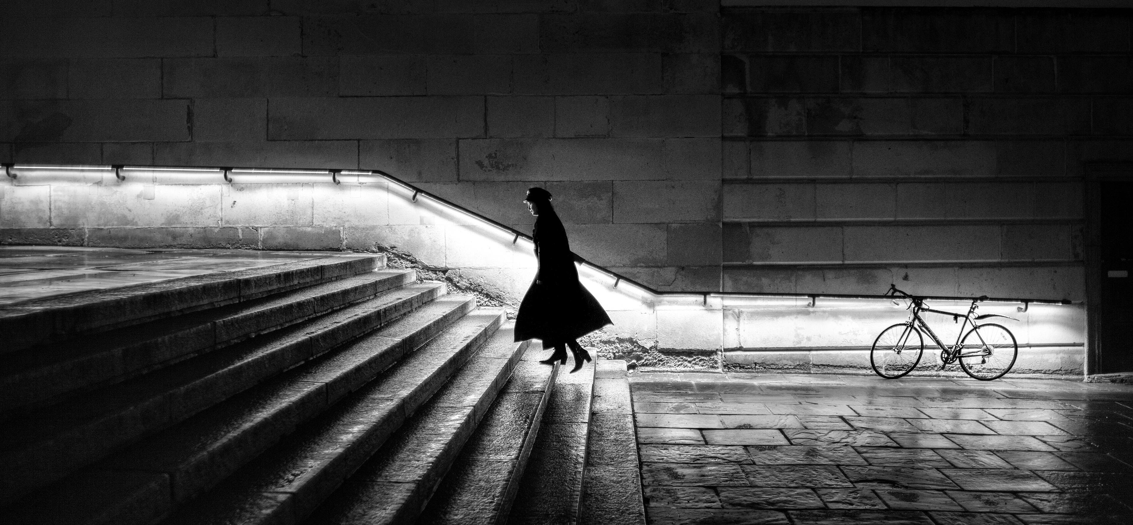 Woman going up stairs.