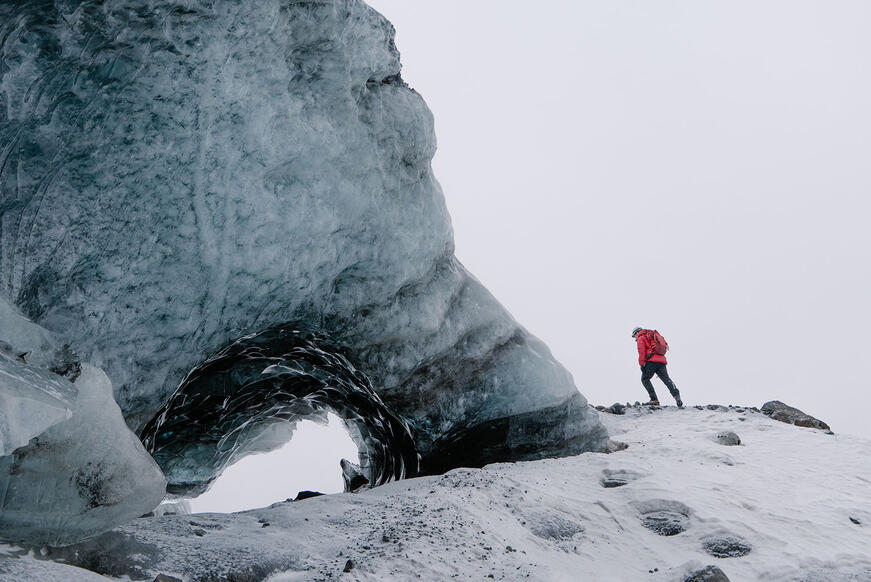 Man climbs an iceberg