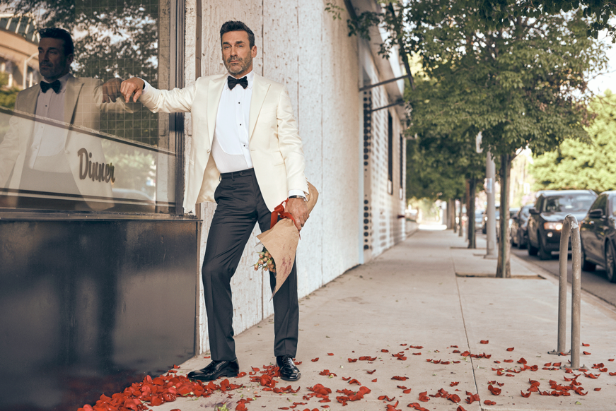 Jon Hamm with a bouquet of roses. 