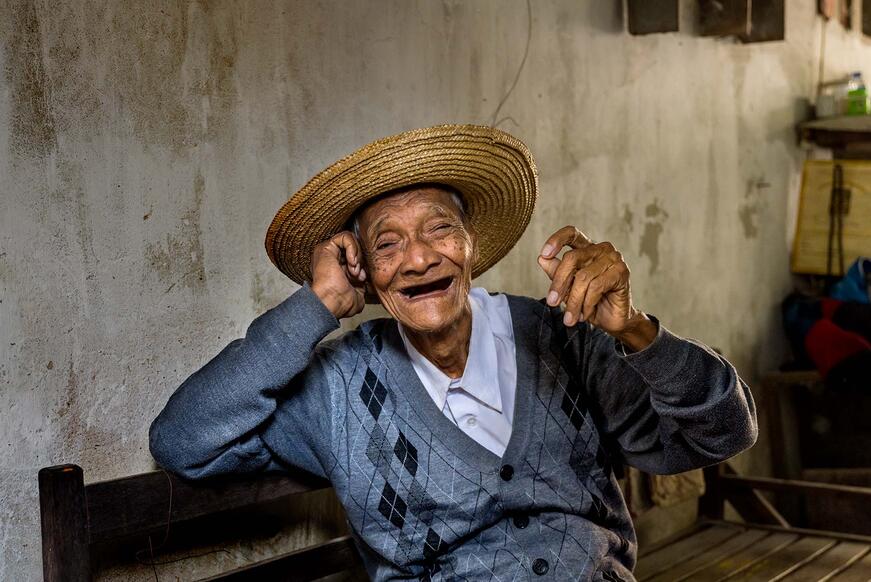 laughing man with hat