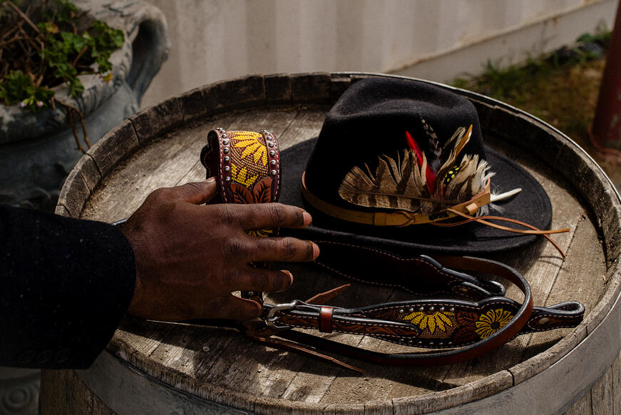 Hat and harness on an old barrel