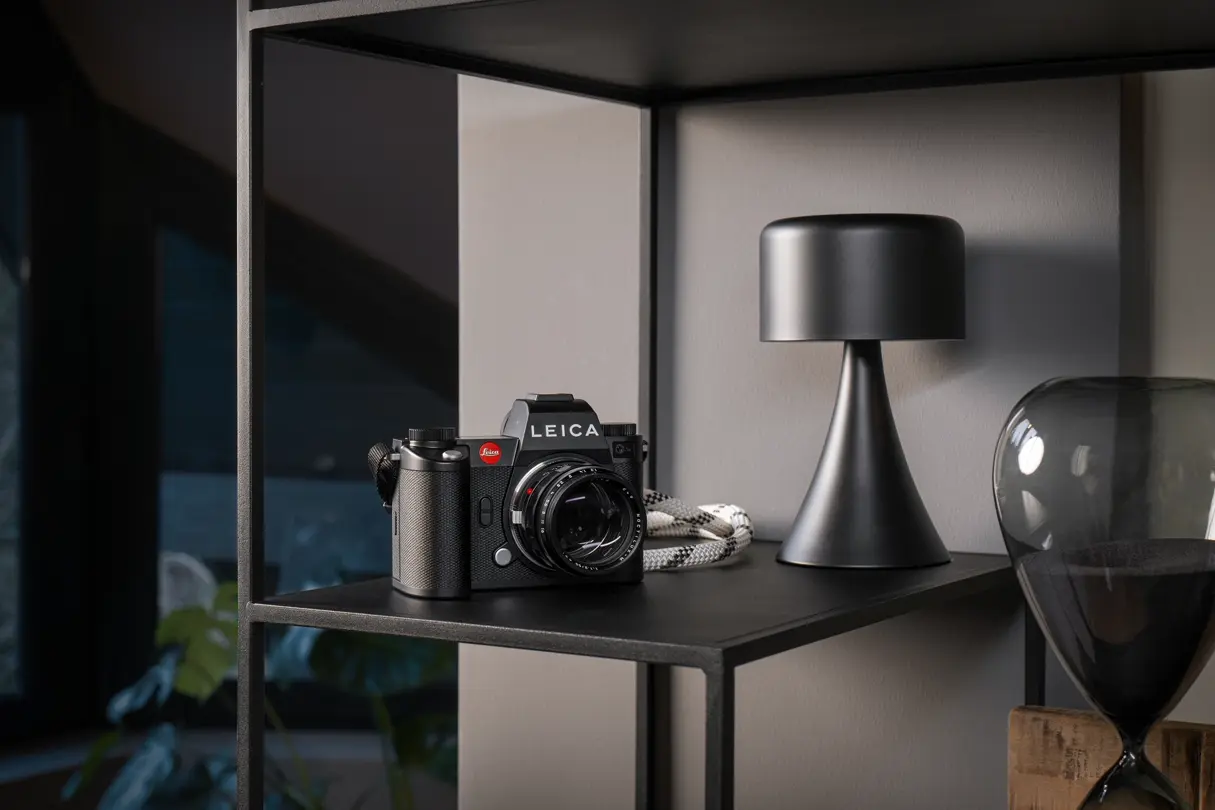 Black Leica Camera on a Table