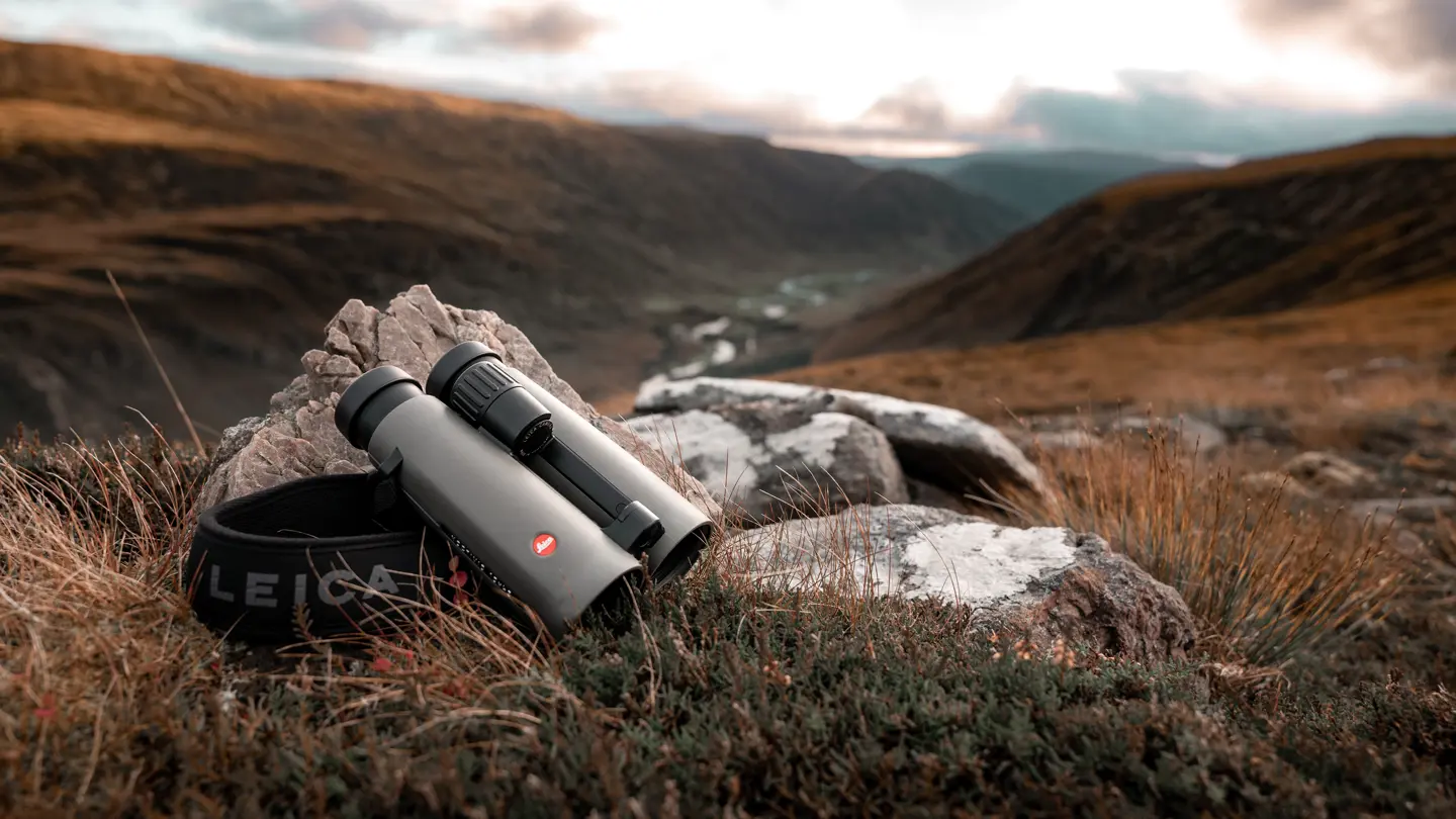 Leica-Noctivid-binoculars-lying-on-a-stone-in-the-Scottish-Highlands