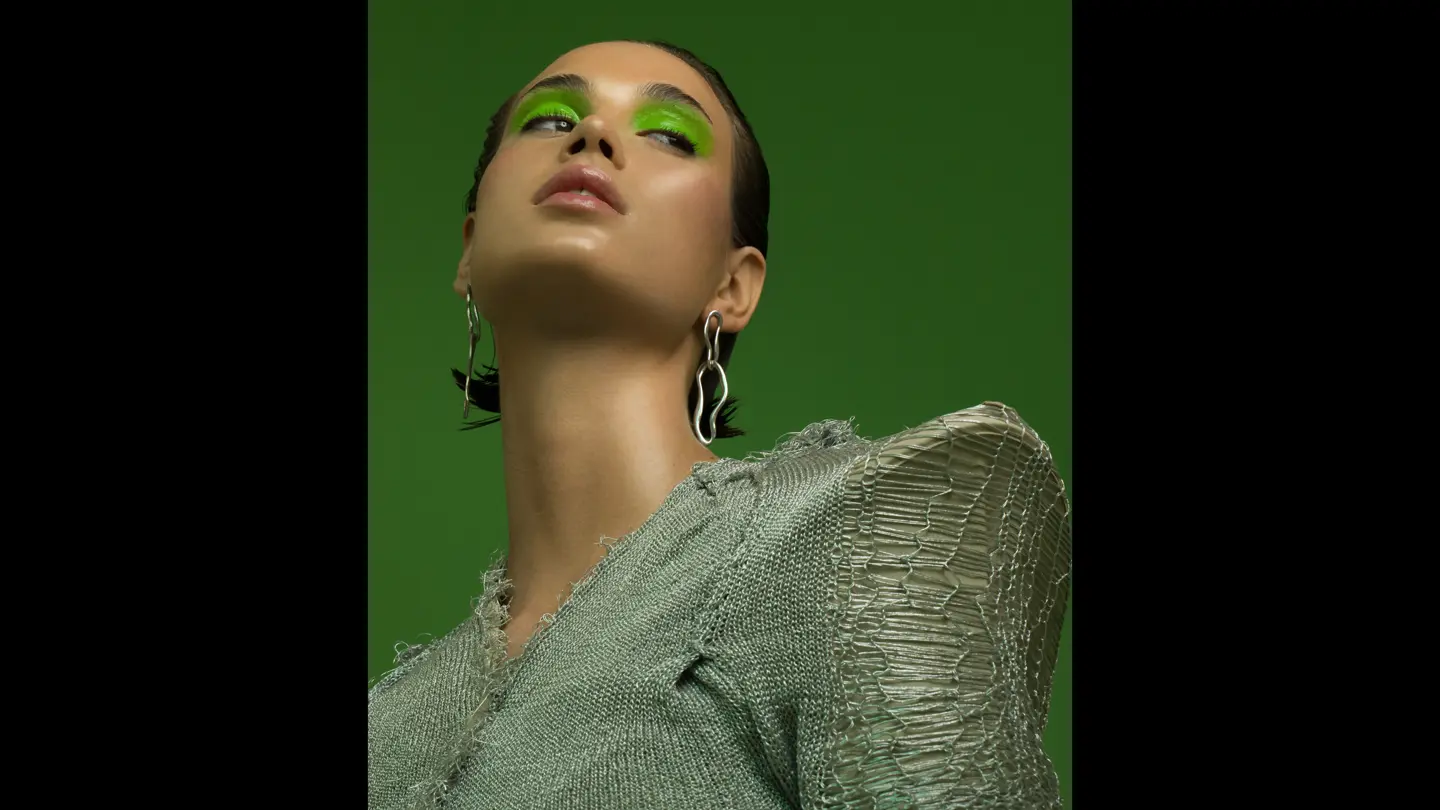 Model in front of green background