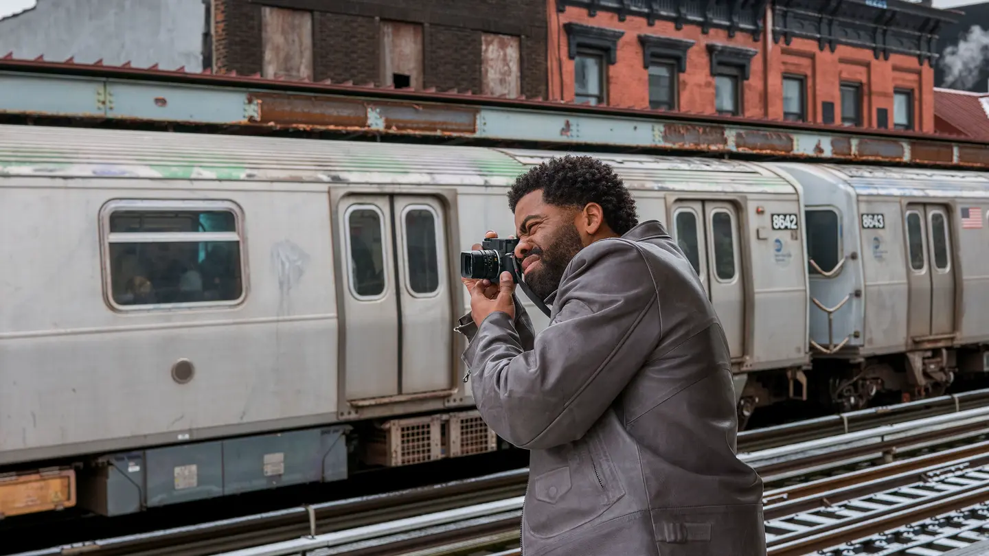Photographer with a leica on a trainstation