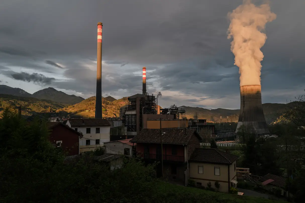 Large smoking chimney of an industrial building