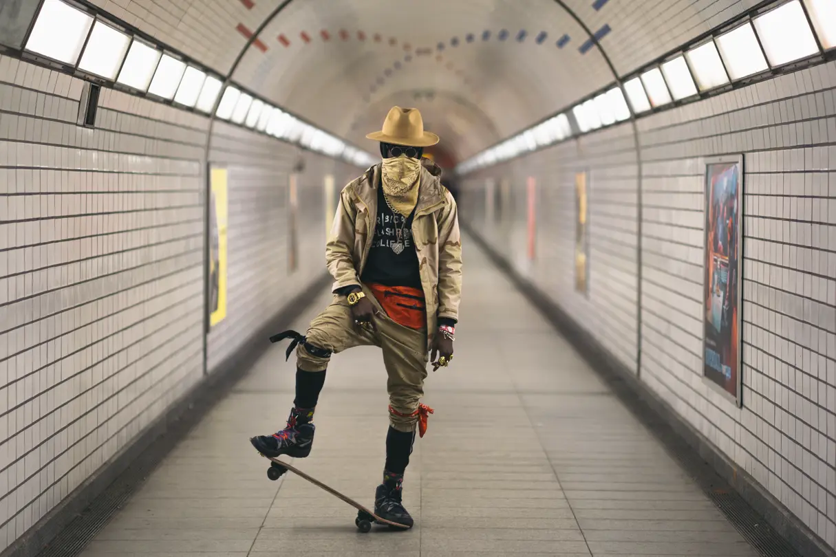 masked man with skateboard