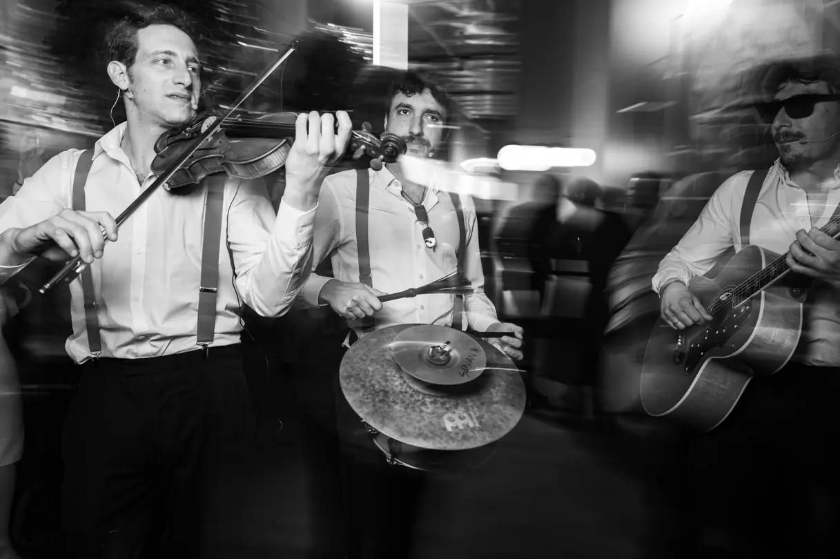Street musician band plays at century event in Milan