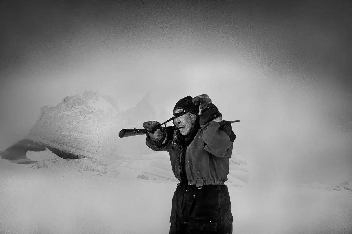 Old hunter in a snowy landscape