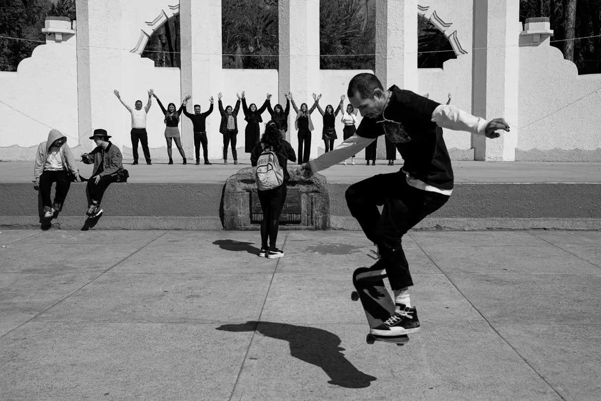 Black and White photo of Skateboarder doing a trick
