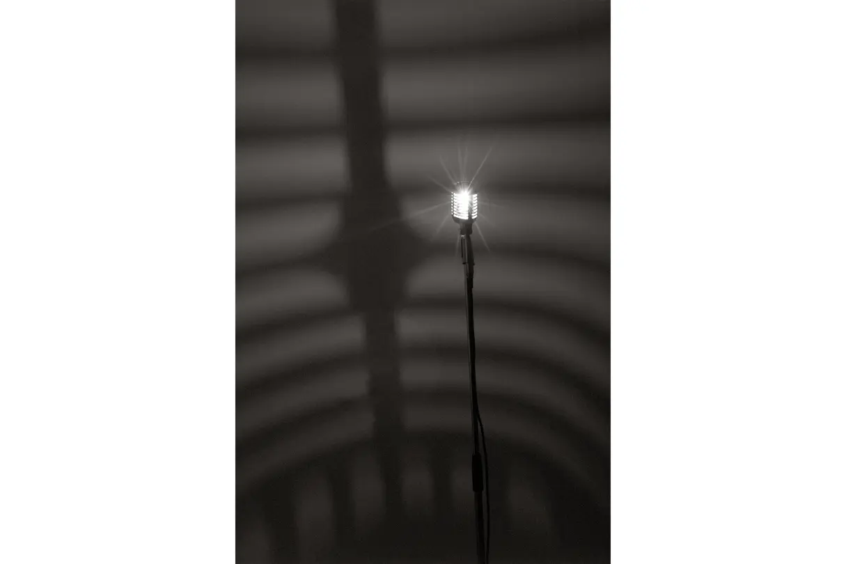 Microphone in front of a dark background
