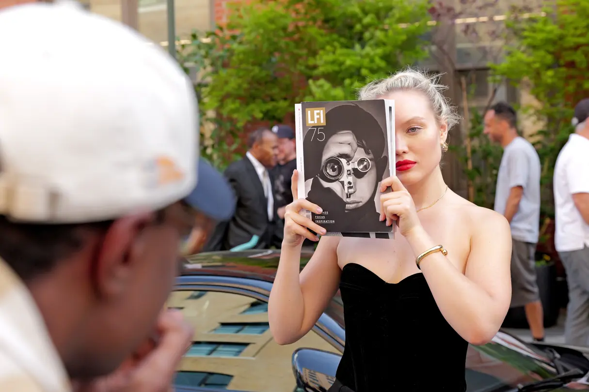women with a book infront of her face