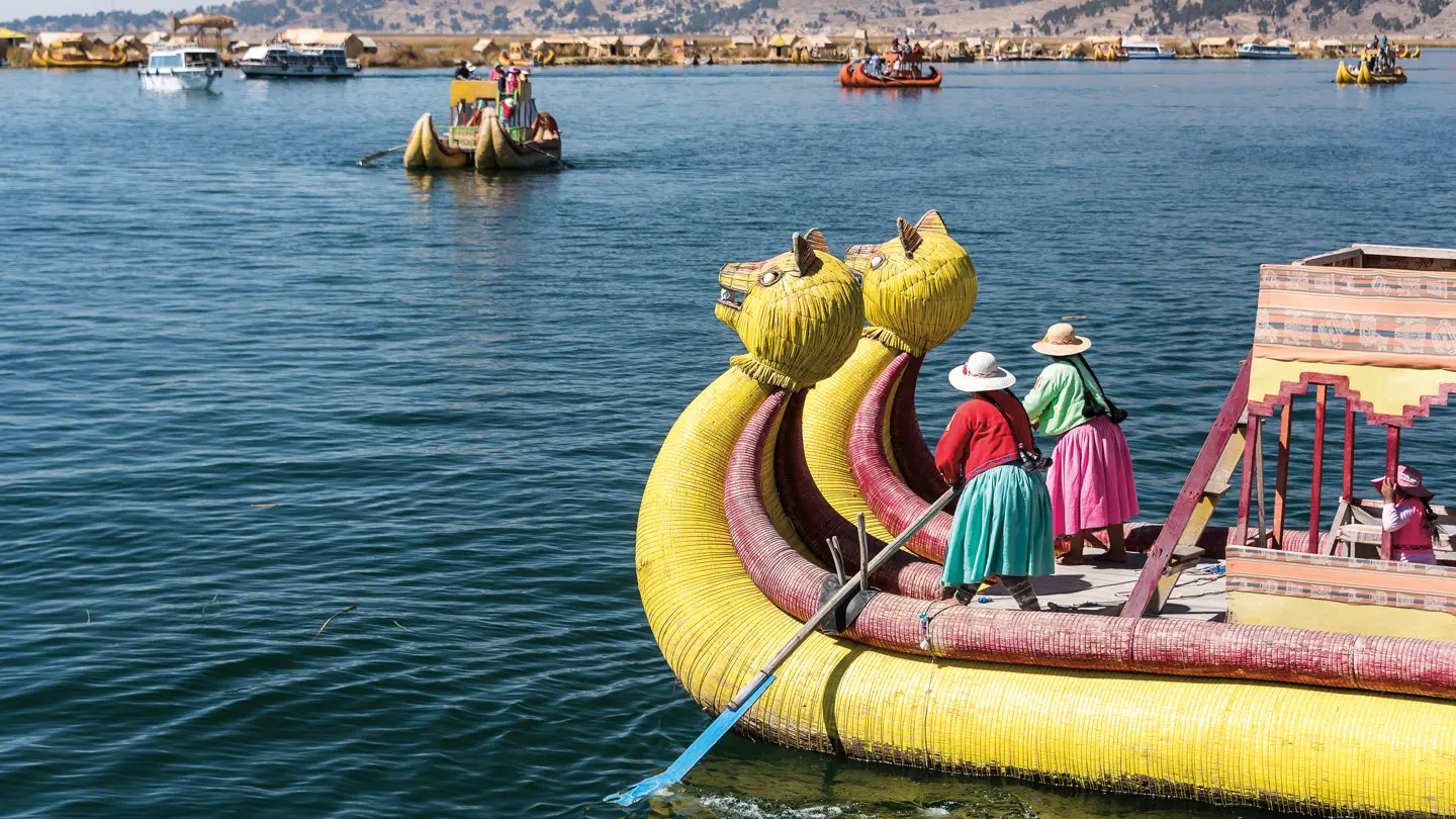 2 women on a yellow dragon boat in Latin America