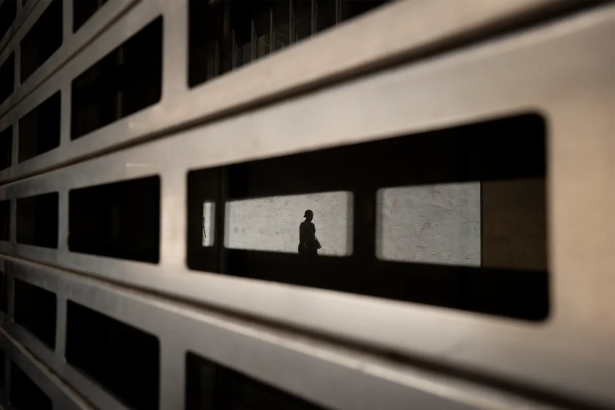 Reflection of a woman in a building