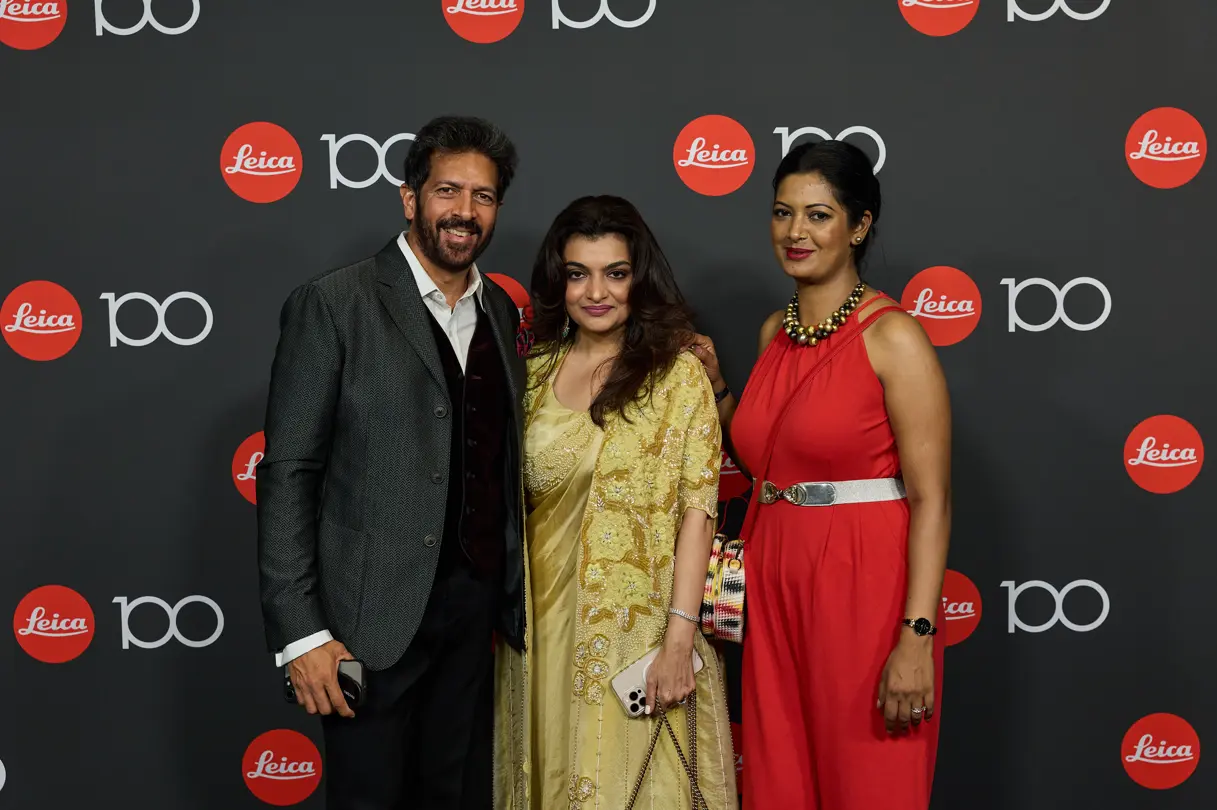 Leica Century Celebration Wetzlar Gala Dinner Guests in front of 100 Years Leica Wall