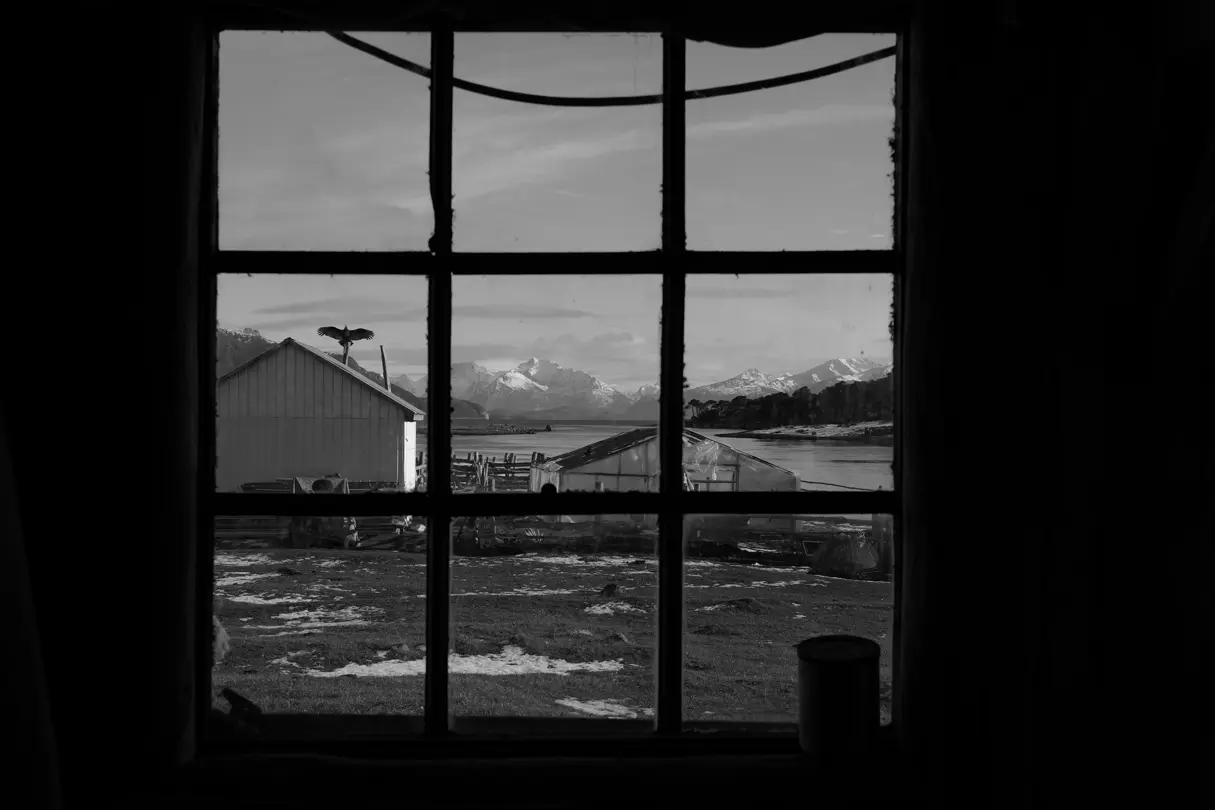 View through window of mountains and a lake