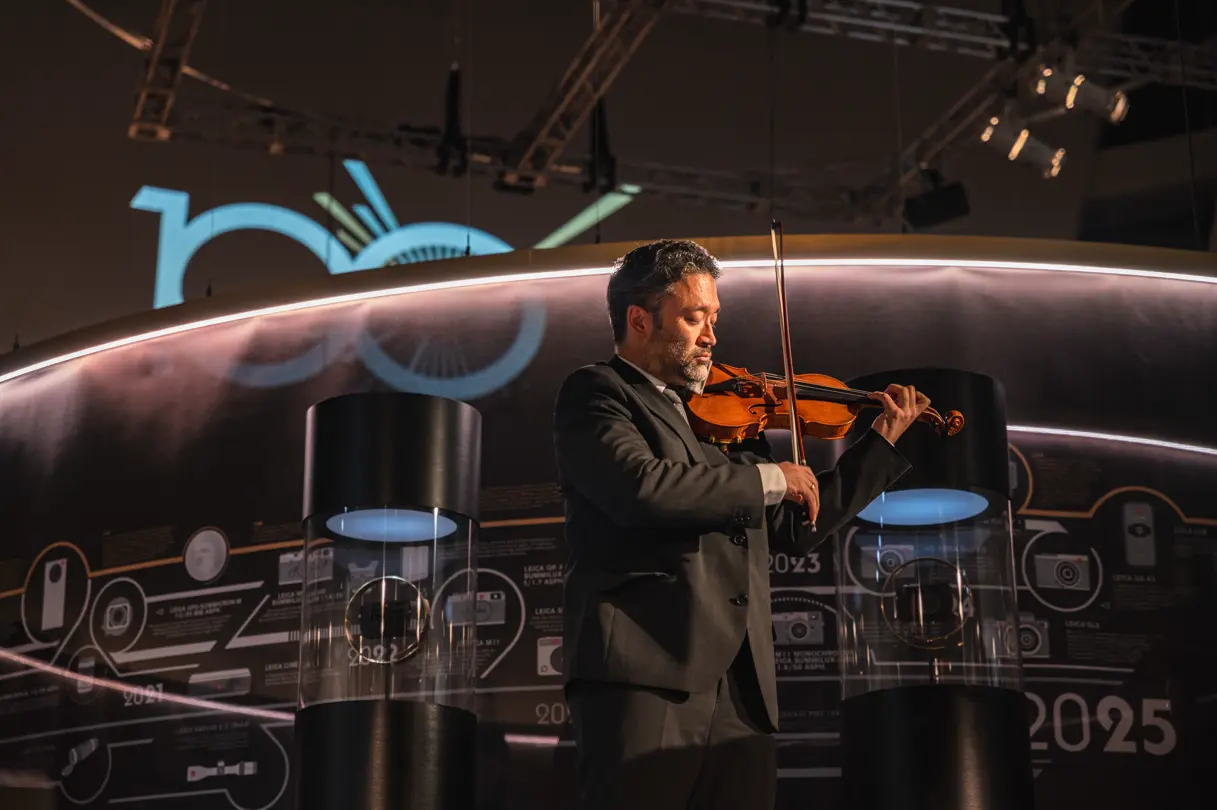 100 Years of Leica in Tokyo musician with his violin on stage