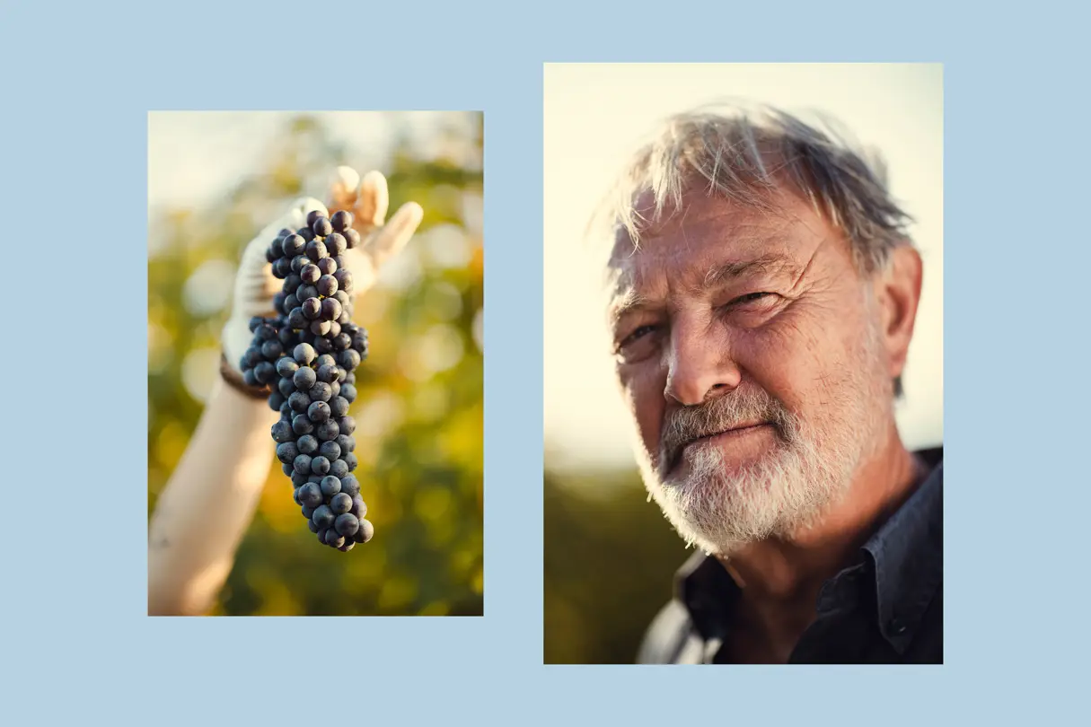 Portrait of an elderly man and a woman's hand holding grapes