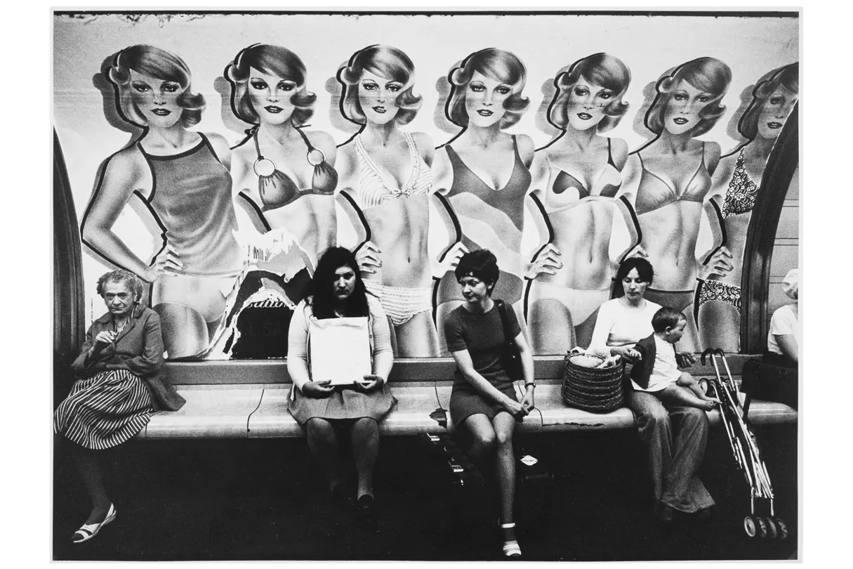 women in front of a wall