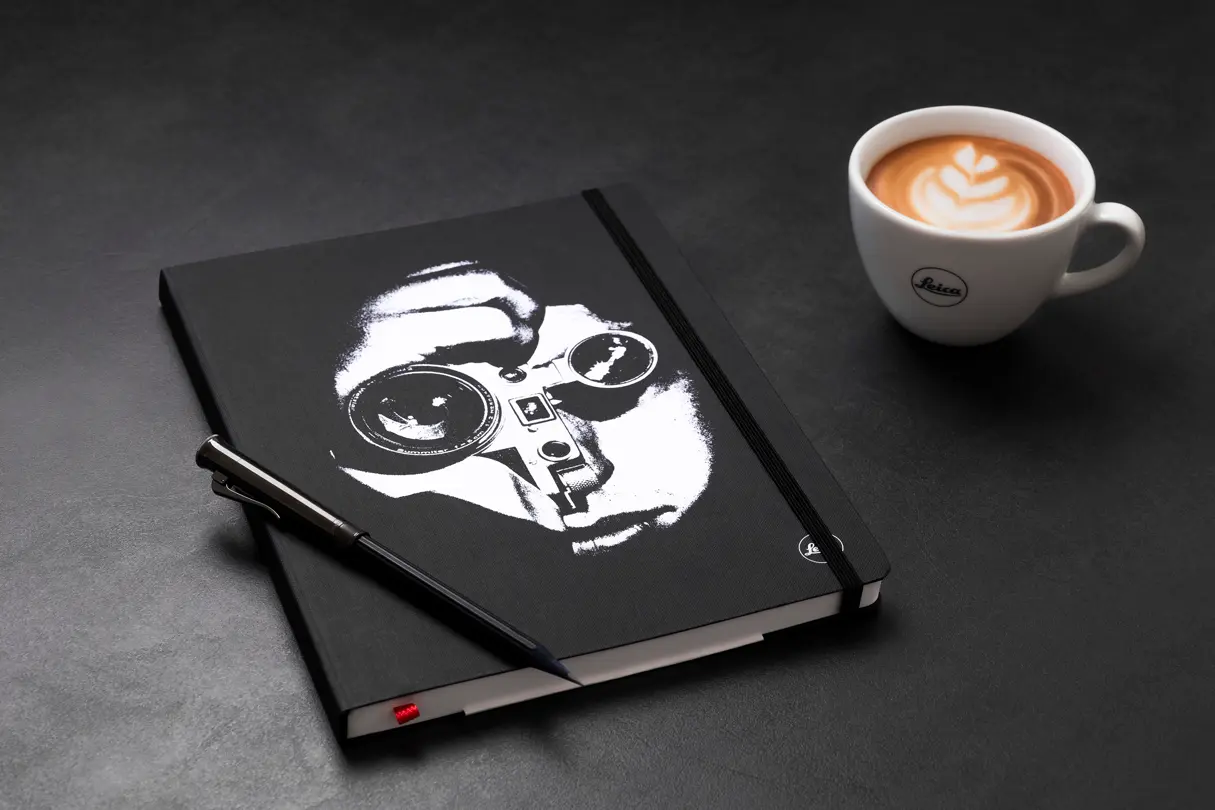 Leica Notebook 'The Photojournalist' with a pencil and Leica Coffe Cup