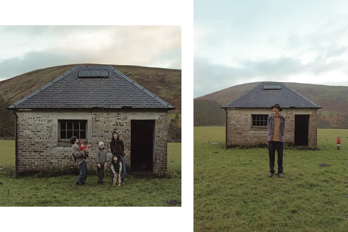 Family in front of an old house in Scotland